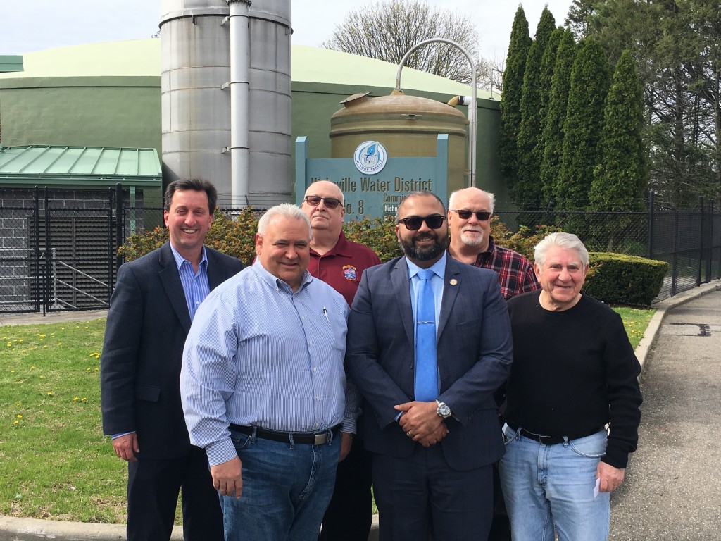 (L to R) Hicksville Water District Engineer of Record, Rich Humann, Commissioner Karl Schweitzer, Commissioner William Schuckmann, New York State Senator Kevin Thomas, Hicksville Water District Interim Superintendent Ken Claus and Commissioner Nicholas Brigandi pose for a photo outside of HWD Plant 8. 