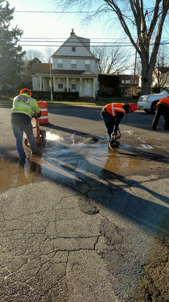 Hicksville Water District crews work diligently to repair a water main break. 